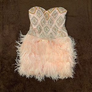 Pink strapless crystal design mini dress with fluff bottom.  Size 6